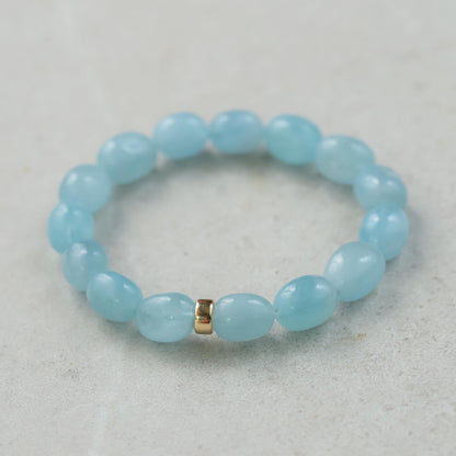 Aquamarine nugget bracelet with 14K gold clasp, featuring polished aquamarine stones on a delicate gold chain.