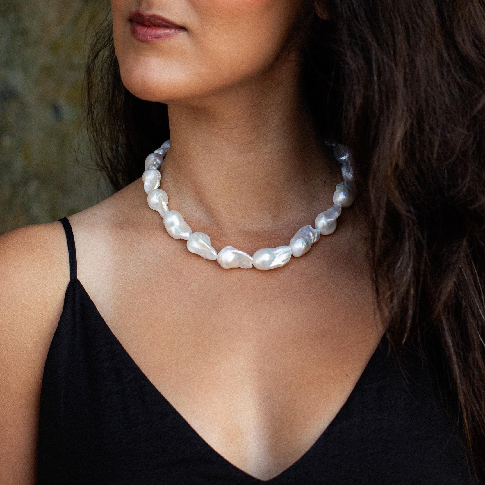 Elegant Baroque pearl necklace by Earthly Abundance featuring irregularly shaped pearls on a delicate chain.