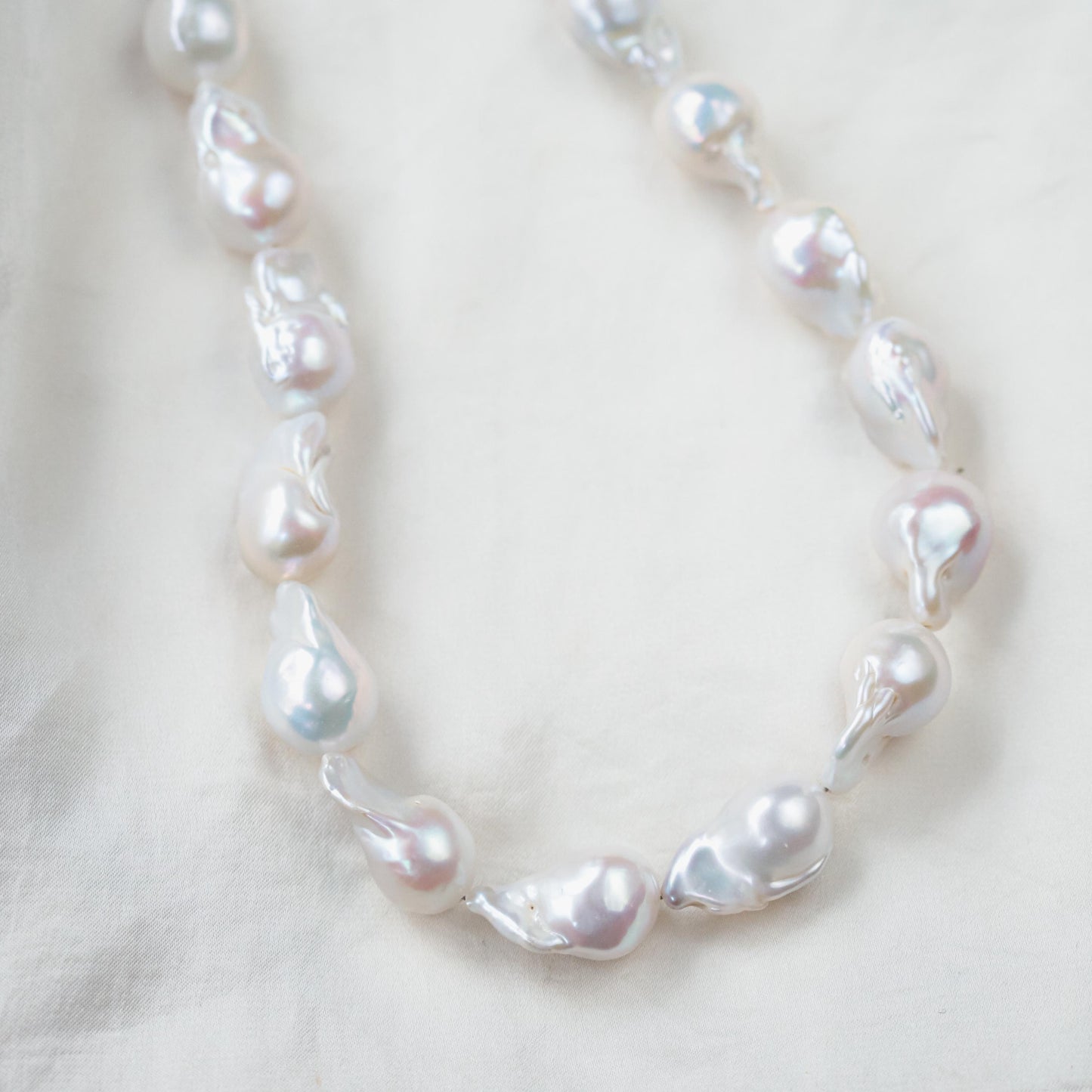 Elegant Baroque Pearl necklace by Earthly Abundance featuring irregular freshwater pearls on a delicate chain.