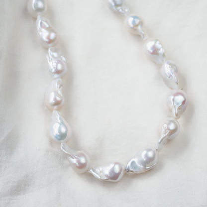 Elegant Baroque Pearl necklace by Earthly Abundance featuring irregular freshwater pearls on a delicate chain.