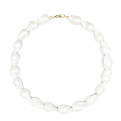 Elegant Baroque Pearl necklace by Earthly Abundance featuring irregular-shaped pearls on a delicate chain.