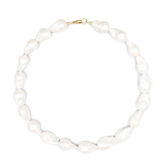 Elegant Baroque Pearl necklace by Earthly Abundance featuring irregular-shaped pearls on a delicate chain.