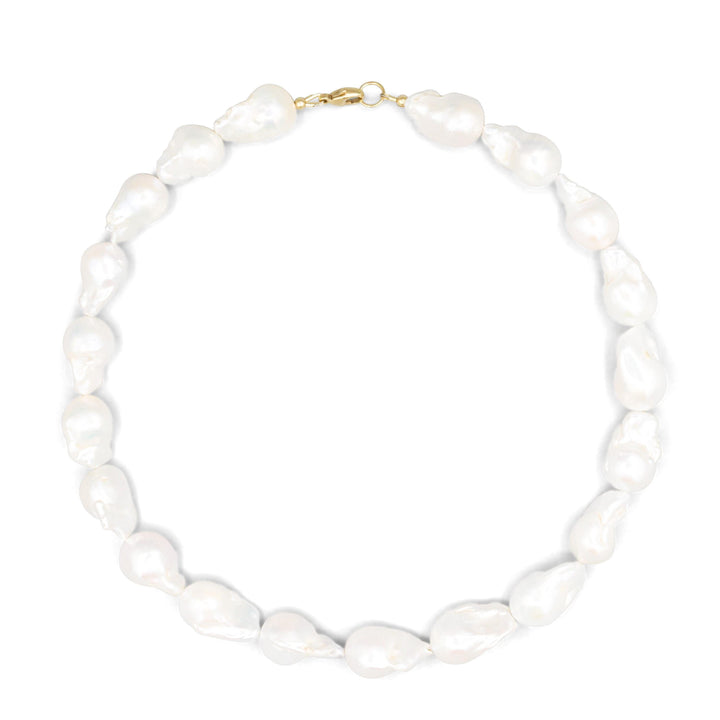 Elegant Baroque Pearl necklace by Earthly Abundance featuring irregular-shaped pearls on a delicate chain.