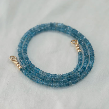 Santa Maria aquamarine drop carabiner clip by Earthly Abundance, featuring a vibrant aquamarine gemstone and metal clasp.