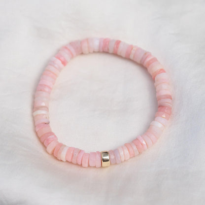 Pink Opal Heishi bracelet by Earthly Abundance featuring small, colorful stone beads on a stretchy elastic band.