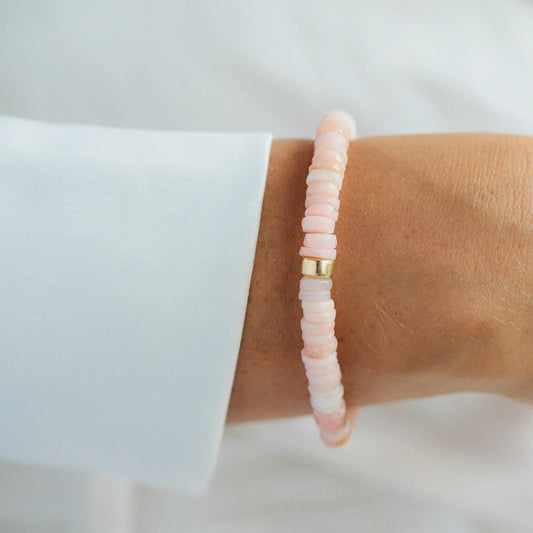 Pink Opal Heishi bracelet with small, colorful beads from Earthly Abundance, displayed on a neutral background.