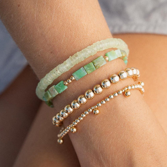 Prehnite beaded bracelet by Earthly Abundance featuring smooth green beads on an elastic stretch bracelet.