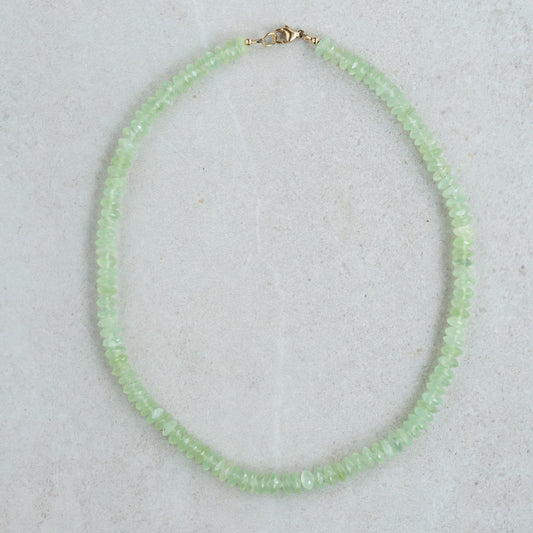 Prehnite necklace with 14K gold chain, featuring a smooth green gemstone pendant, by Earthly Abundance.