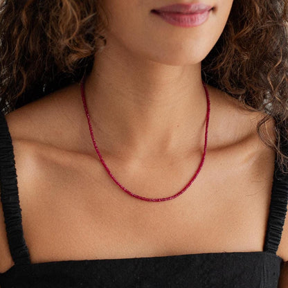 Carmine Longido Ruby Necklace featuring vibrant red rubies on a delicate gold chain from Earthly Abundance.