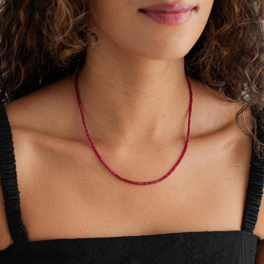 Carmine Longido Ruby Necklace featuring vibrant red rubies on a delicate gold chain from Earthly Abundance.
