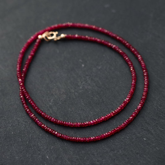 Carmine Longido Ruby Necklace featuring vibrant red gemstones on a delicate chain, from Earthly Abundance.