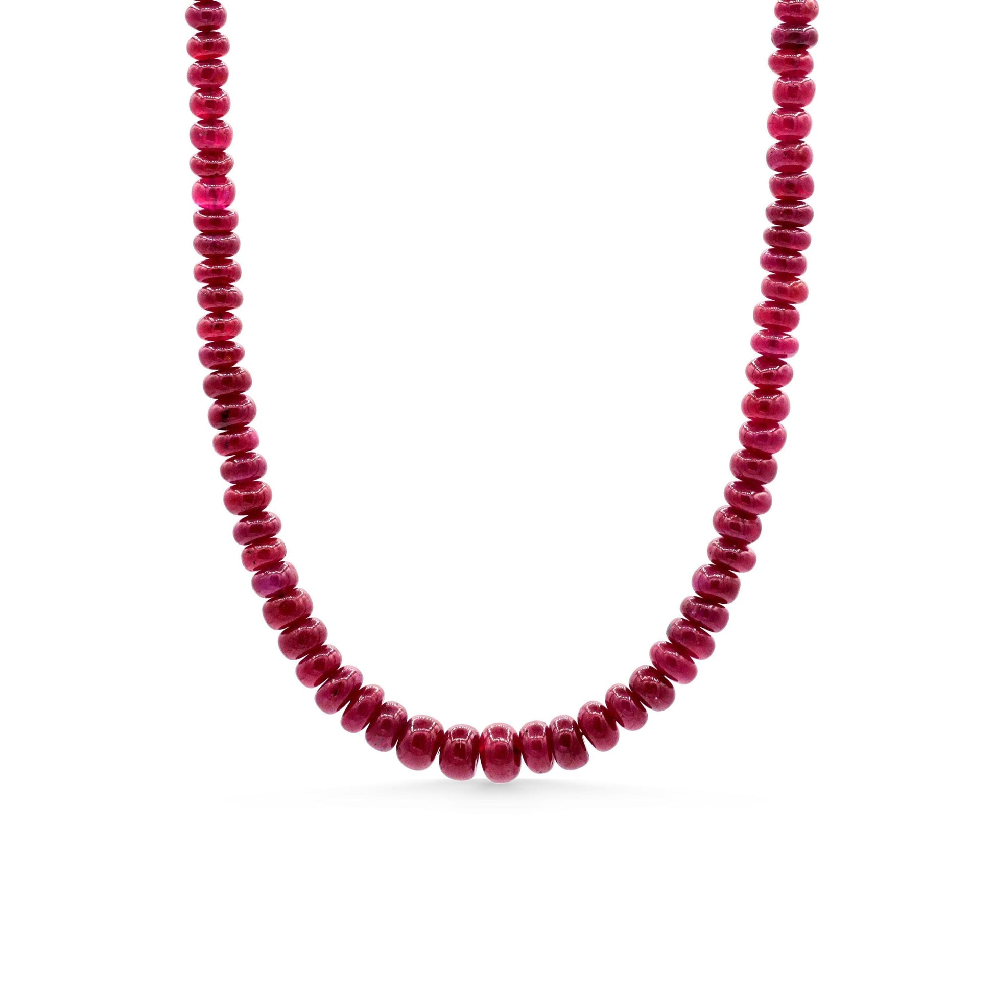 14K Crown Longido Ruby Necklace by Earthly Abundance featuring a vibrant red ruby pendant on a gold chain.