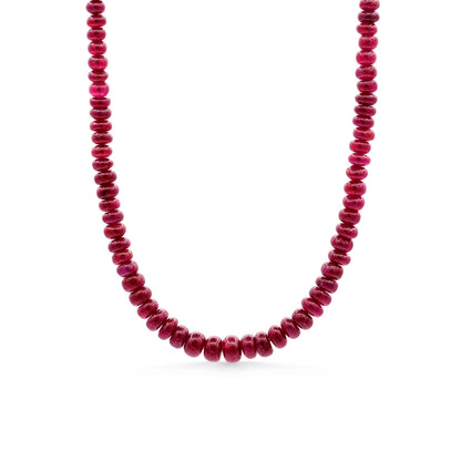 14K Crown Longido Ruby Necklace by Earthly Abundance featuring a vibrant red ruby pendant on a gold chain.