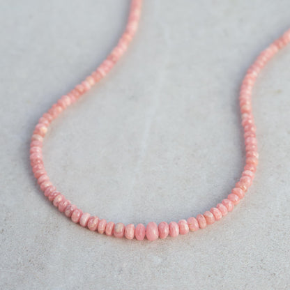 Earthly Abundance Rhodochrosite necklace featuring polished pink stones on a delicate silver chain.