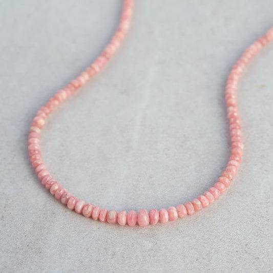 Earthly Abundance Rhodochrosite necklace featuring polished pink stones on a delicate silver chain.