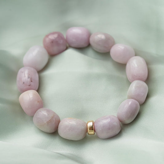 Kunzite nugget bracelet made with 14K gold from Earthly Abundance, featuring smooth pink kunzite stones on a delicate chain.