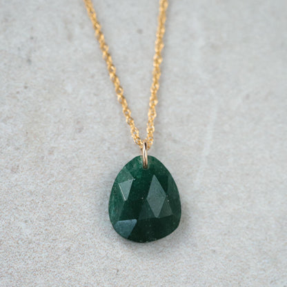 Green aventurine pendant in 14K gold setting, featuring a polished gemstone on a delicate chain.