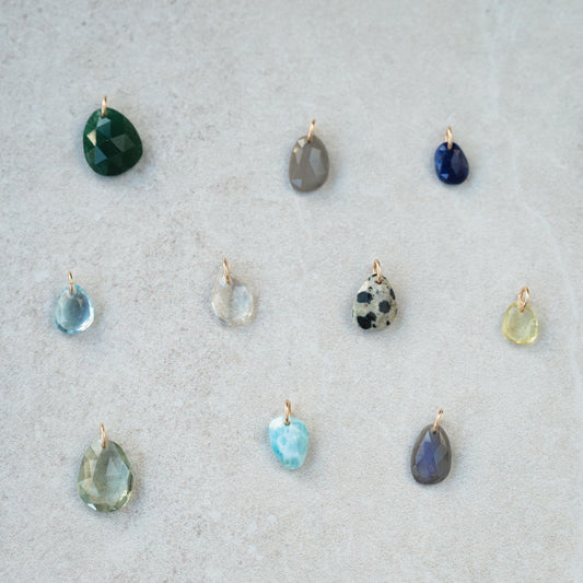 Green aventurine pendant in 14K gold setting, showcasing a smooth, polished gemstone on a delicate chain.