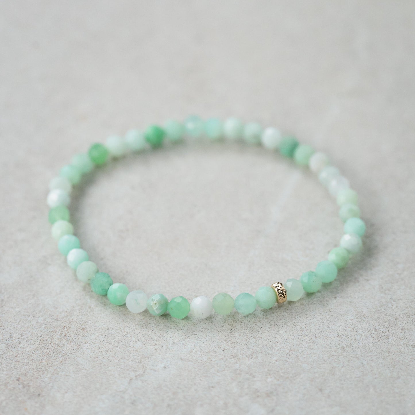 Chrysoprase bracelet with 14K gold accents from Earthly Abundance, featuring polished green gemstone beads on a delicate chain.