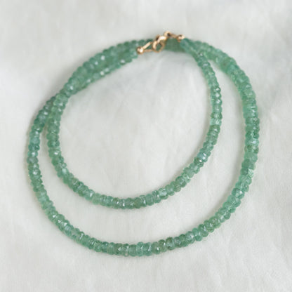 Green Kyanite necklace from Earthly Abundance featuring a polished green kyanite pendant on a leather cord.