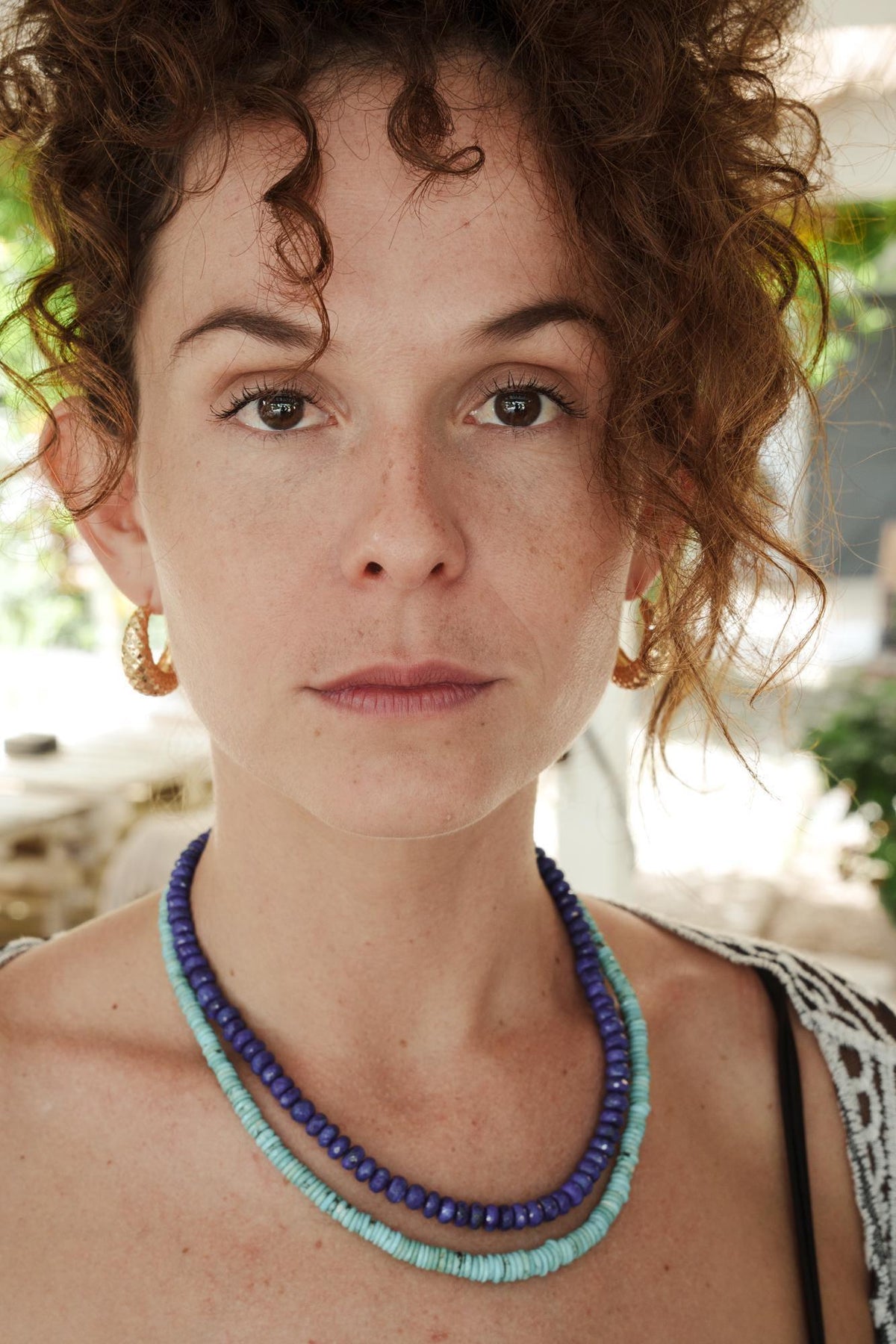 Faceted lapis lazuli rondel necklace by Earthly Abundance featuring deep blue gemstone beads on a delicate string.