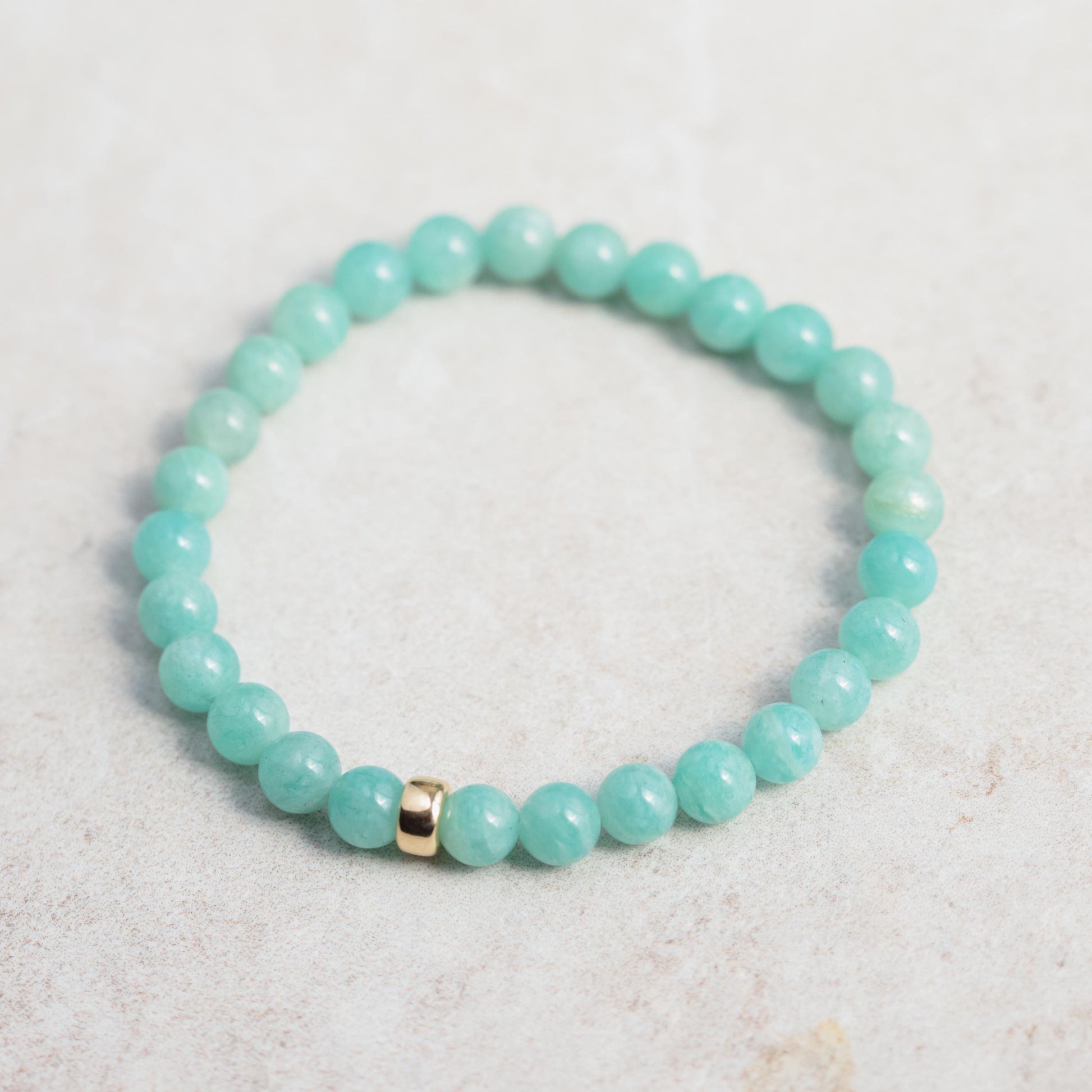 Sixmm Brazilian Amazonite bracelet with polished blue-green stones, featuring a natural stone clasp, by Earthly Abundance.