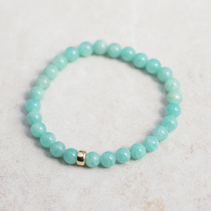 Sixmm Brazilian Amazonite bracelet with polished blue-green stones, featuring a natural stone clasp, by Earthly Abundance.