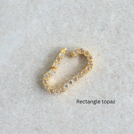 Gold vermeil charm holder with white topaz accents, 3 microns thick, designed by Earthly Abundance for elegant jewelry display.