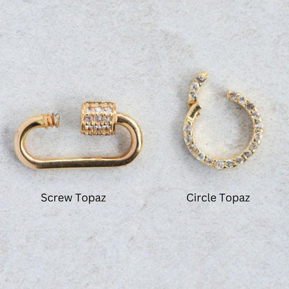 Gold vermeil charm holder with white topaz accents, 3 microns thick, by Earthly Abundance, featuring intricate design and sparkling stones.
