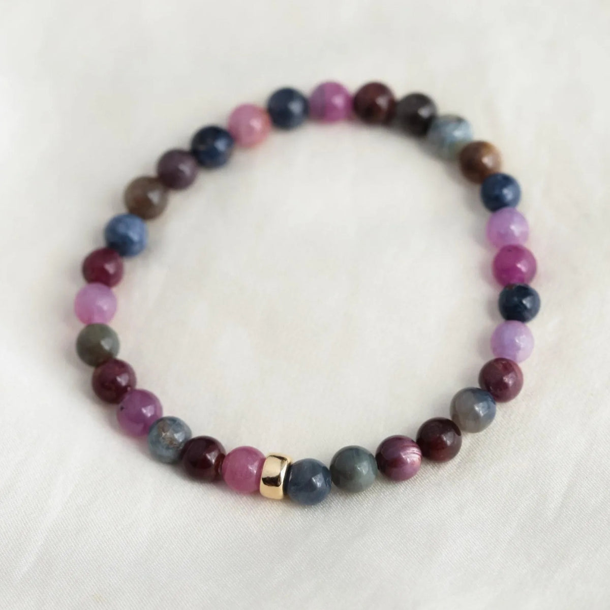 Elegant Ruby and Sapphire bracelet in 14K gold featuring vibrant gemstones from Earthly Abundance.