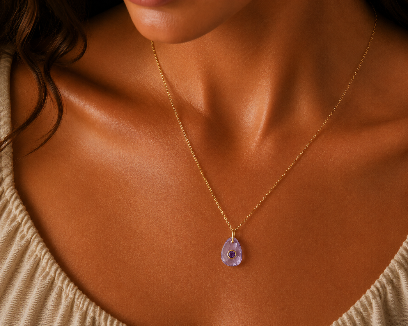 Violet Muse Amethyst Pendant Necklace by Earthly Abundance featuring a polished purple amethyst gemstone on a silver chain.