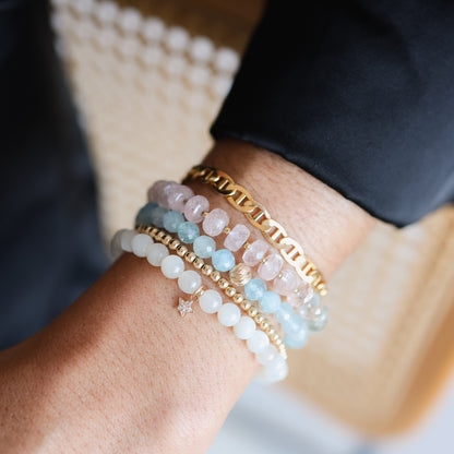 Faceted aquamarine bracelet by Earthly Abundance featuring shimmering blue stones on a delicate silver chain.