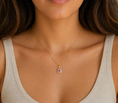 Dawn Muse Pendant by Earthly Abundance featuring peach moonstone and amethyst gemstones on a silver chain.