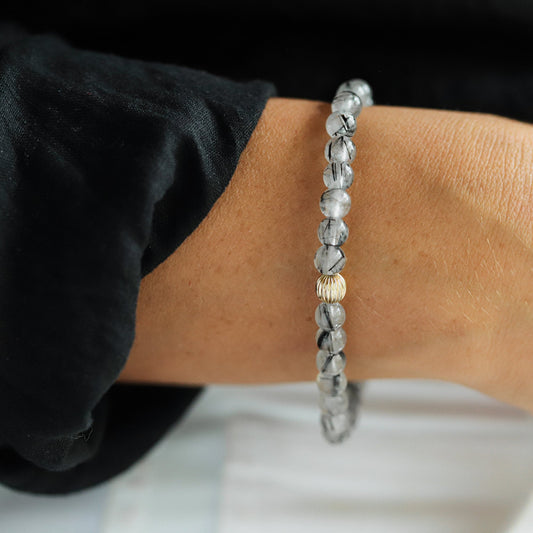 Black rutilated quartz with evil eye charm