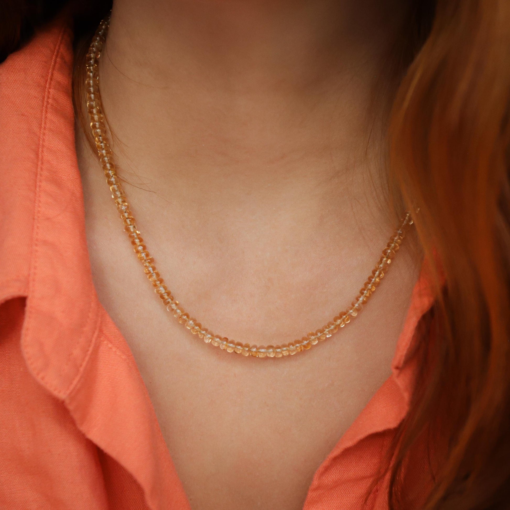 Luminous citrine necklace by Earthly Abundance featuring a large, glowing yellow gemstone pendant on a delicate chain.