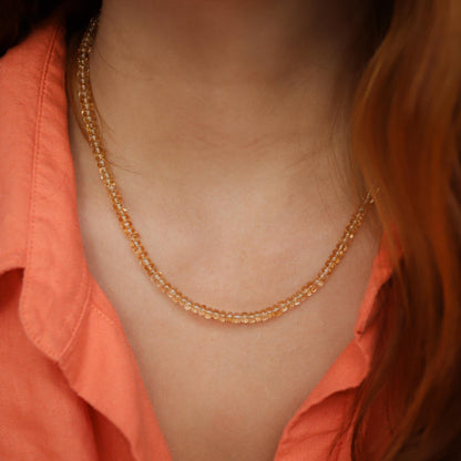 Luminous citrine necklace by Earthly Abundance featuring a large, glowing yellow gemstone pendant on a delicate chain.