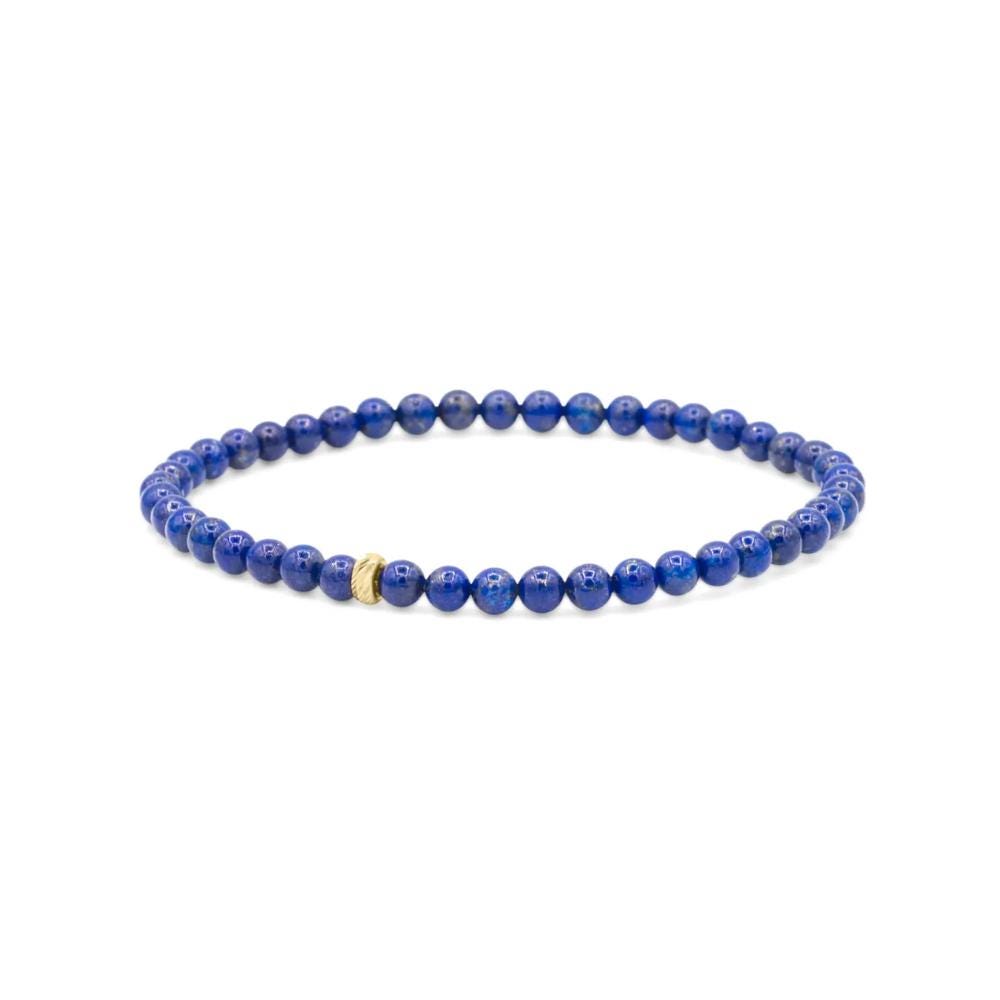 Lapis Lazuli bracelet with 14K gold accents from Earthly Abundance Jewelry, featuring deep blue stones and gold spacers.