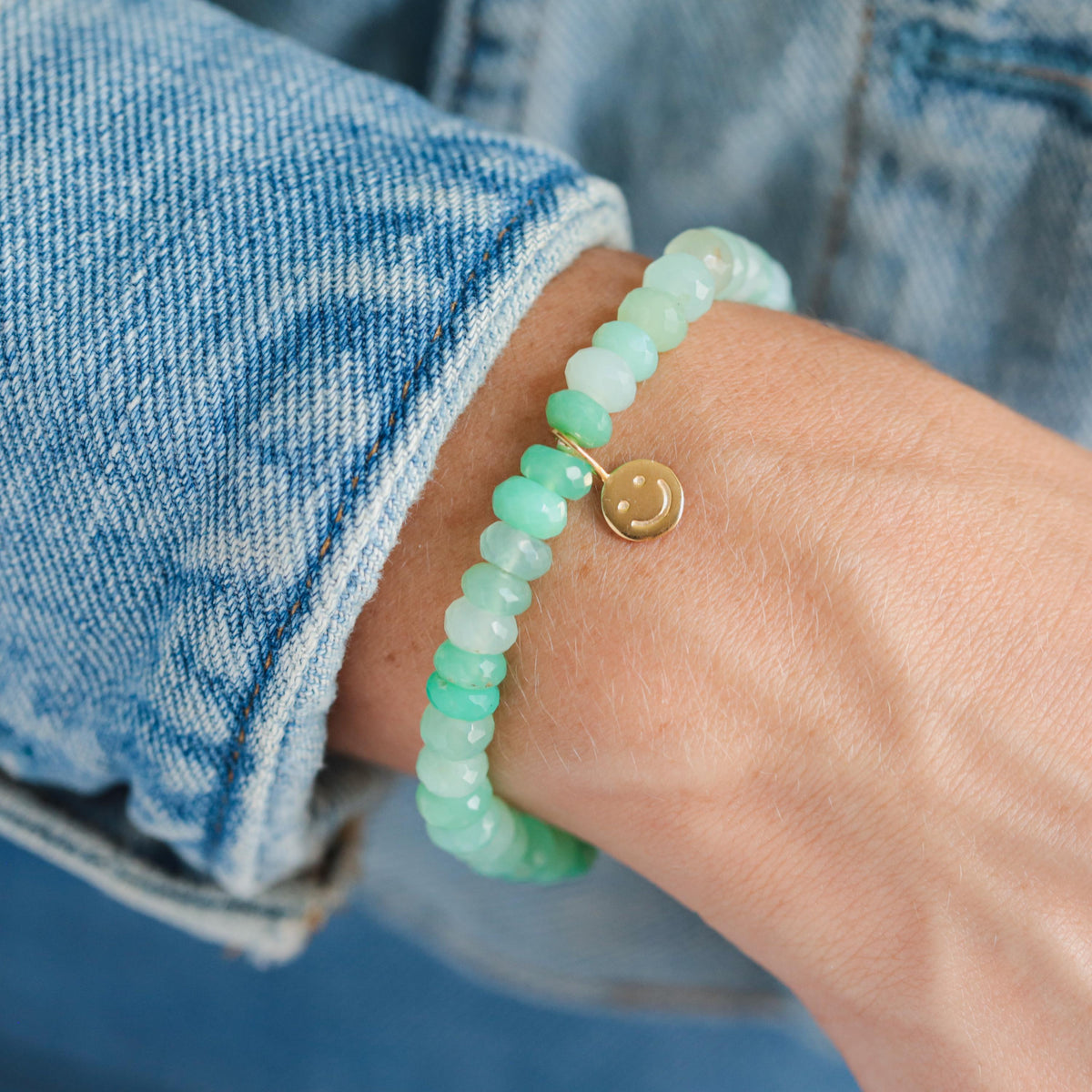 Chrysoprase smiley bracelet featuring green gemstone beads from Earthly Abundance, displayed on a white background.