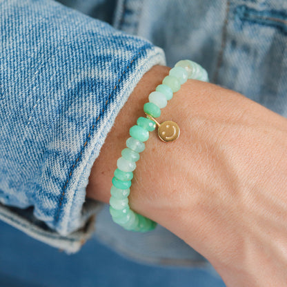 Chrysoprase smiley bracelet featuring green gemstone beads from Earthly Abundance, displayed on a white background.