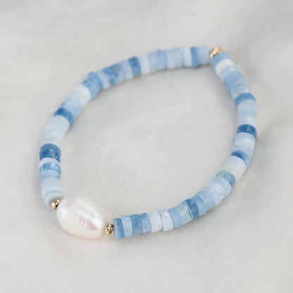 Heishi gemstone and pearl bracelet featuring colorful beads and white pearls, handcrafted by Earthly Abundance.