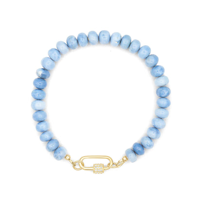 Blue opal topaz bracelet with sterling silver clasp, featuring vibrant blue gemstones and intricate design details.