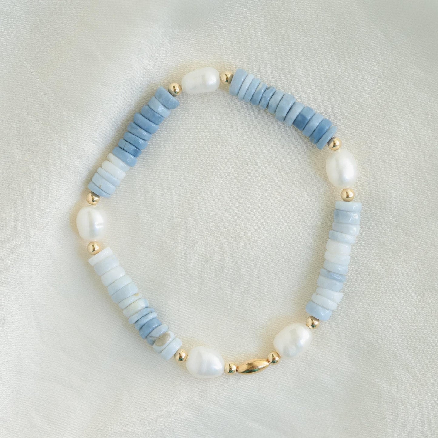 Ocean Whisper bracelet featuring opal and pearl beads from Earthly Abundance Jewelry, showcasing a delicate, elegant jewelry piece.