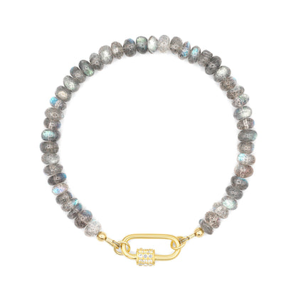 Blue fire bracelet featuring labradorite and white topaz beads from Earthly Abundance, displayed on a neutral background.