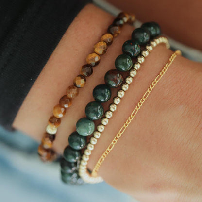 Grounded Strength Bloodstone bracelet by Earthly Abundance featuring polished bloodstone beads on an elastic band.
