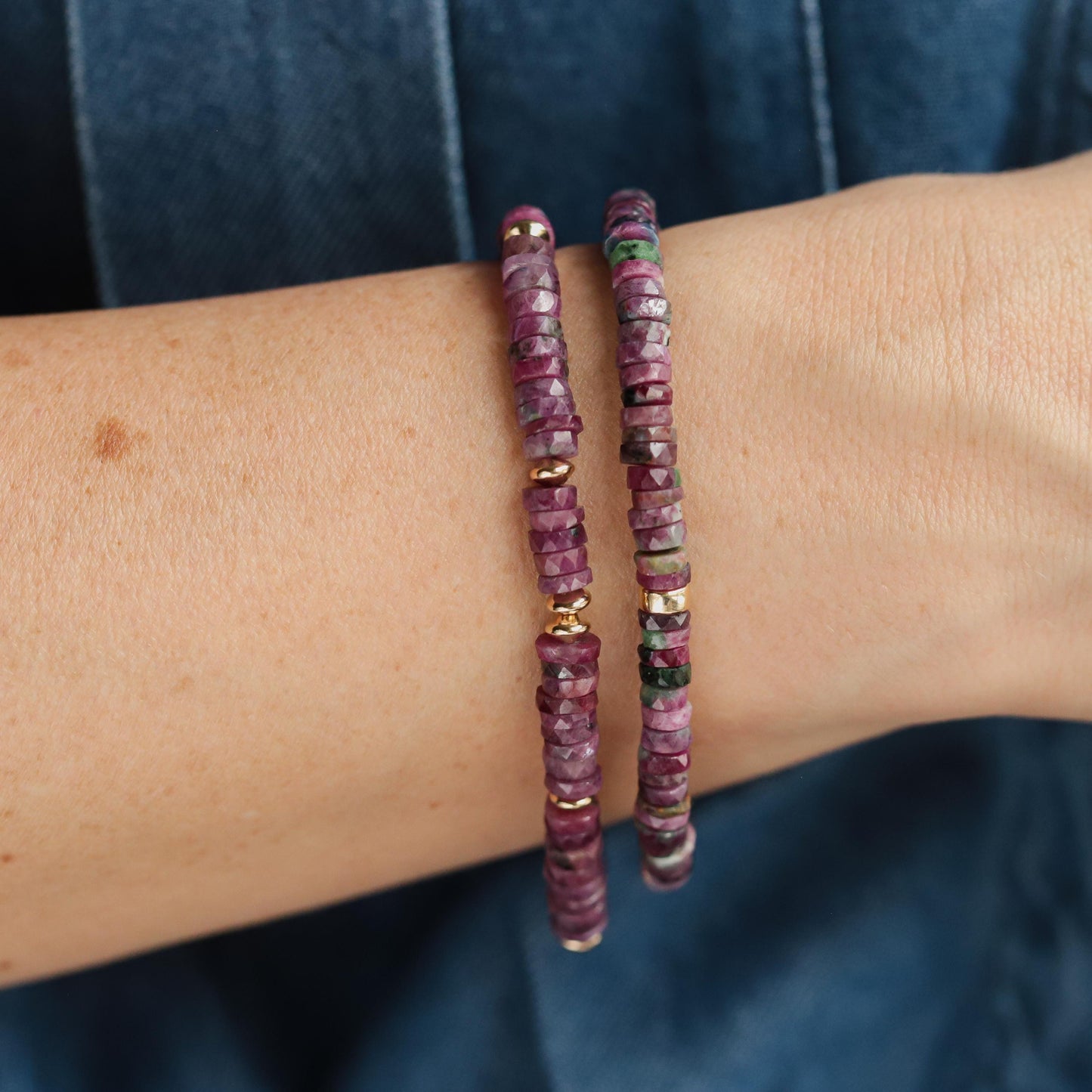 Earthly Abundance Ruby Heishi bracelet with small red gemstone beads, natural minimalist jewelry style on a neutral background.