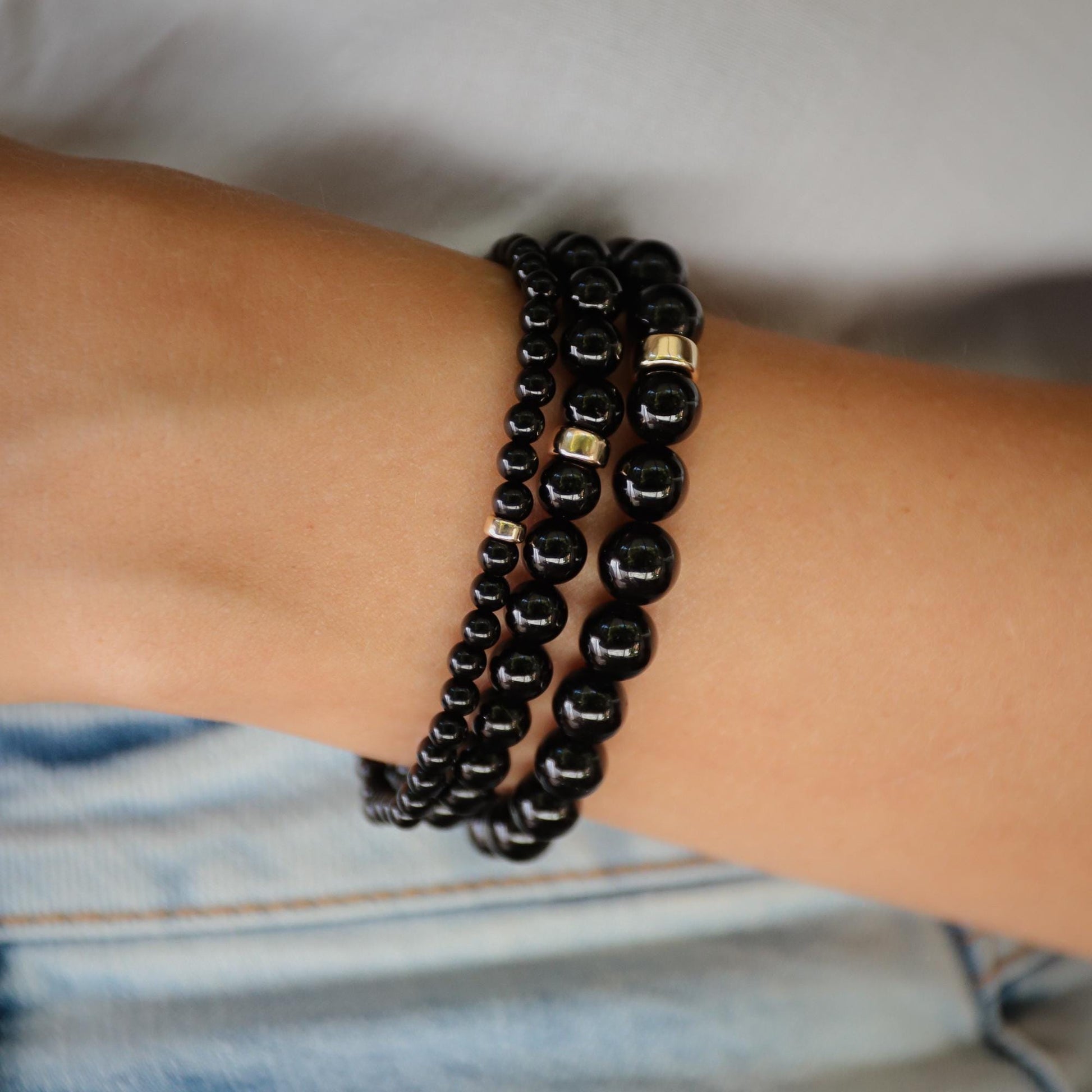 Black Tourmaline bracelet from Earthly Abundance Jewelry featuring polished beads and a secure stretch band.
