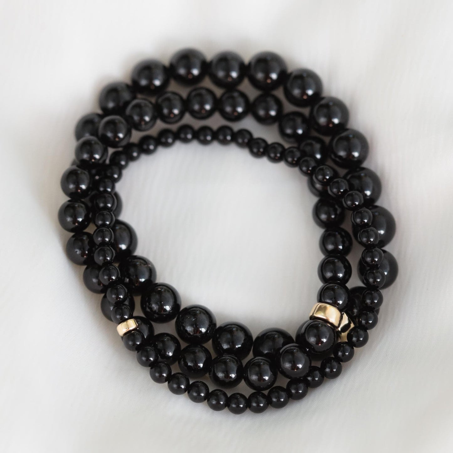 Black tourmaline bracelet by Earthly Abundance Jewelry featuring protective black stones on a stretch cord.