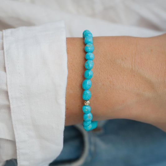 Earthly Abundance Jewelry Sleeping Beauty Everyday Bracelet featuring turquoise beads and silver accents on a delicate chain.