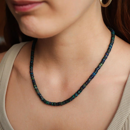 Iridescent Fire Black Ethiopian Opal necklace featuring a shimmering black opal pendant on a delicate chain, from Earthly Abundance.