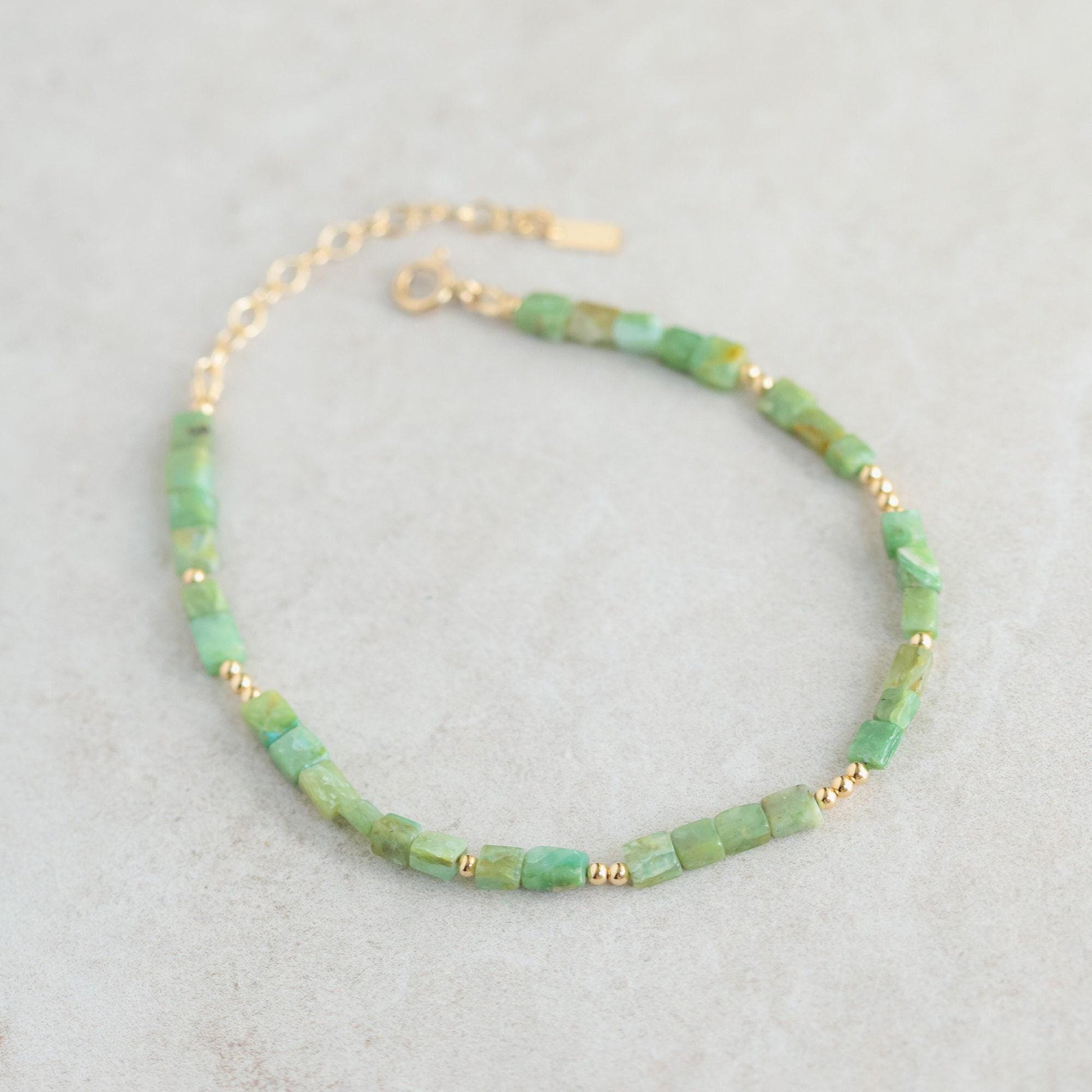 Square cut Peruvian Opal anklet with 14K gold filled chain from Earthly Abundance, showing the jewelry detail and elegant design.